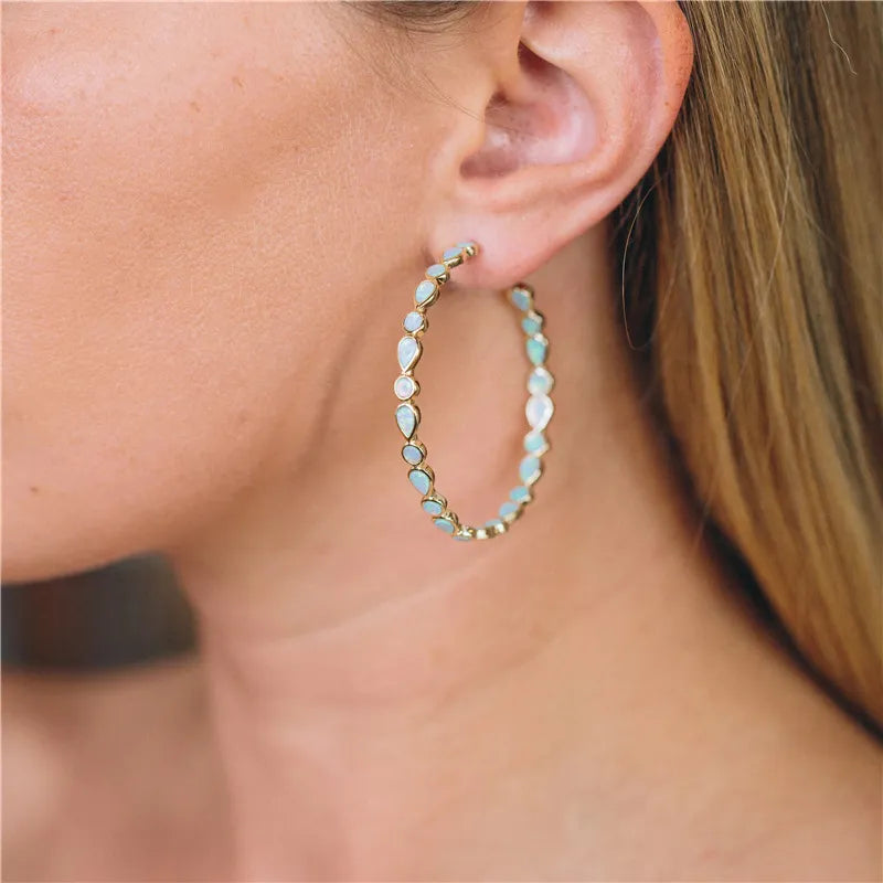 Glänzende Eleganz - Ohrringe mit blauem Opal und Gold