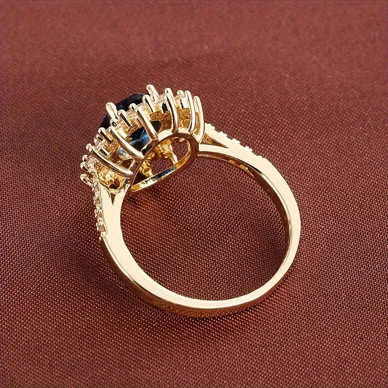 Delphine – Eleganter goldener Ring mit blauem Stein