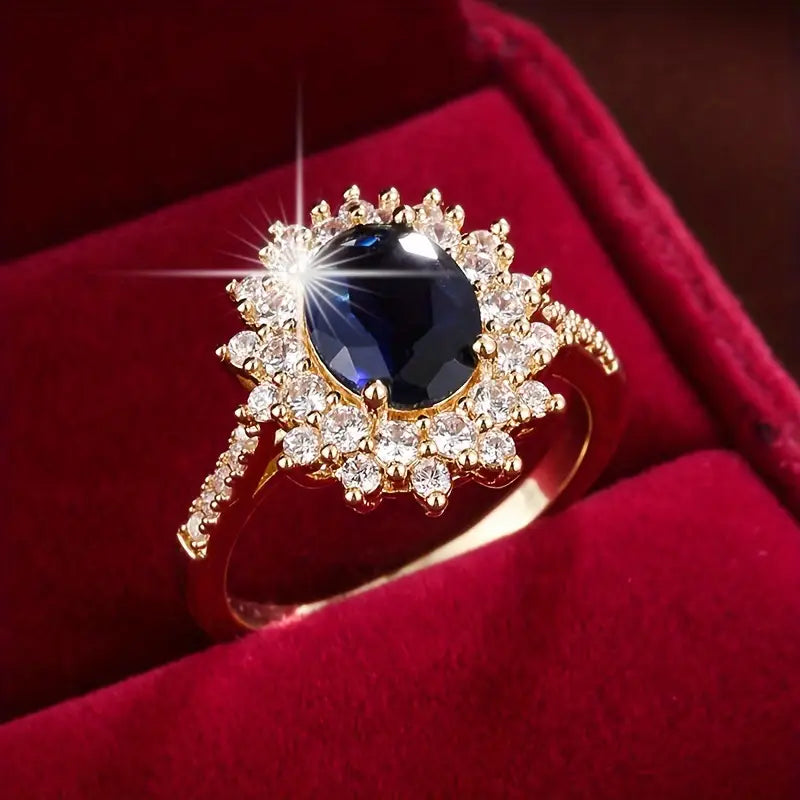 Delphine – Eleganter goldener Ring mit blauem Stein
